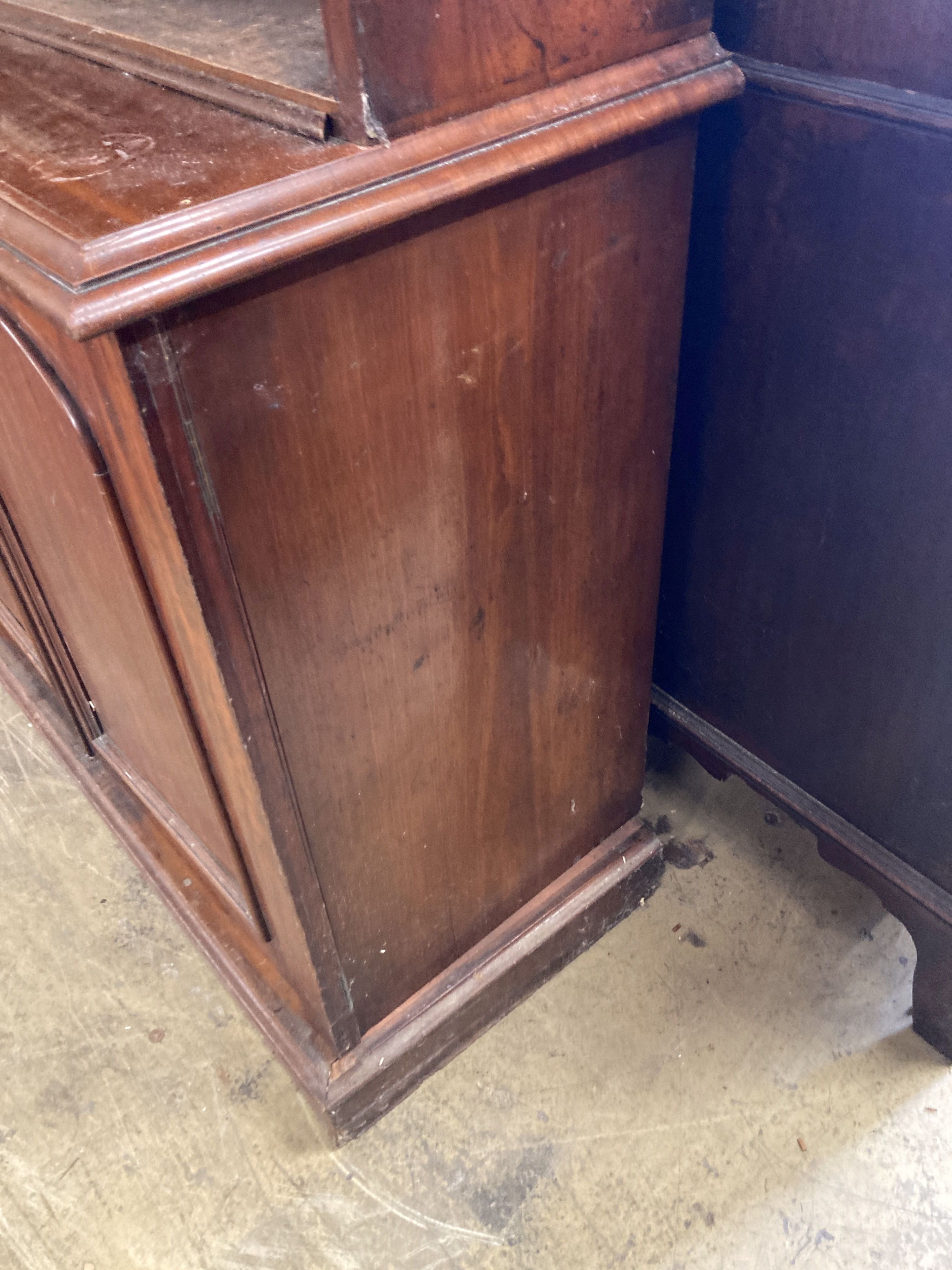 A Victorian mahogany library bookcase, the open shelves over an enclosed four door base, length 230cm, depth 50cm, height 238cm